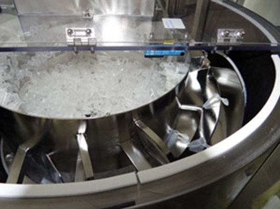 Picture of the vibratory feeder in the bottle plant