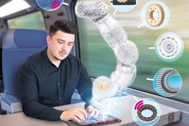 Travail sur tablette dans un train, consistant à animer un bras de robot